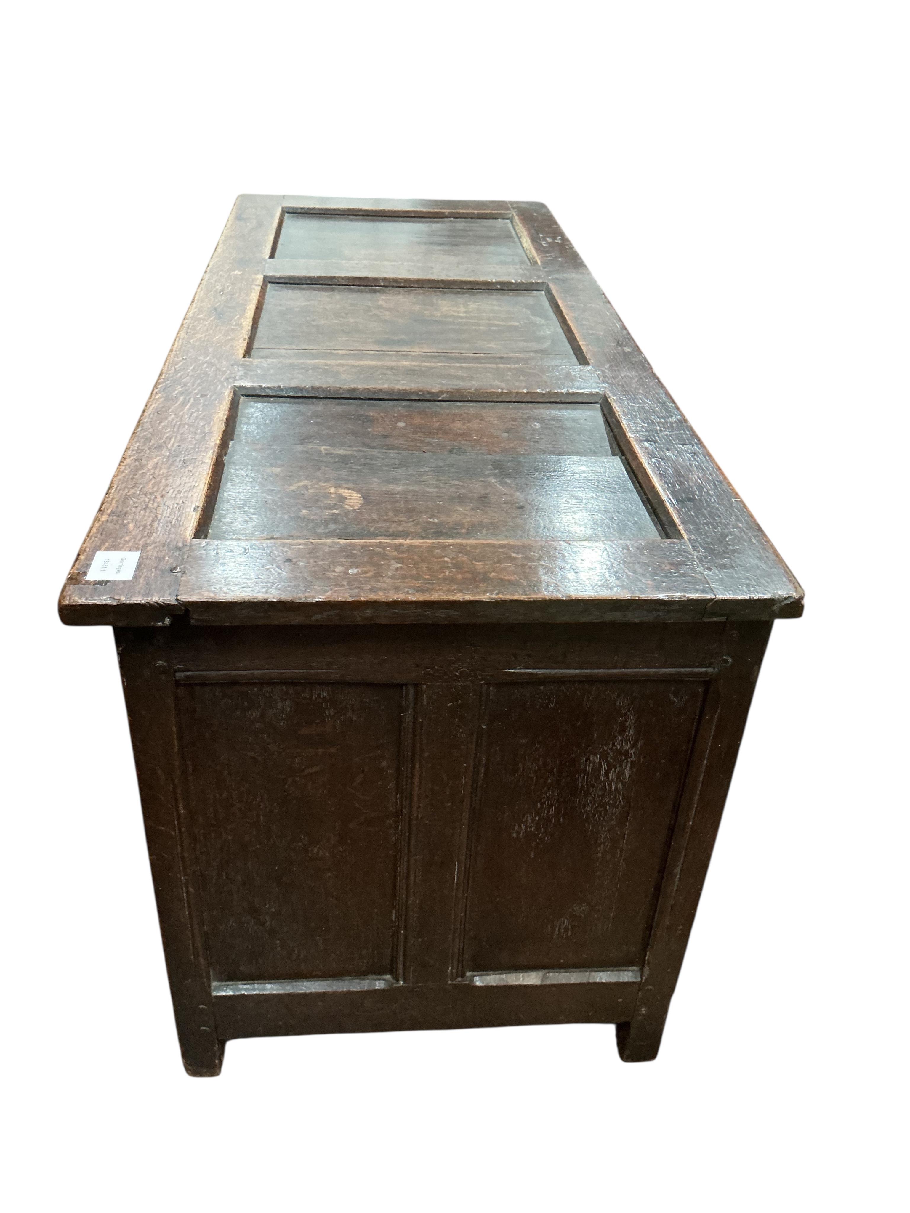 An early 18th century parquetry inlaid panelled oak coffer, width 131cm, depth 54cm, height 64cm